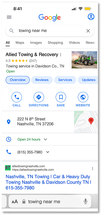 Towing company google business profile displaying on mobile phone.